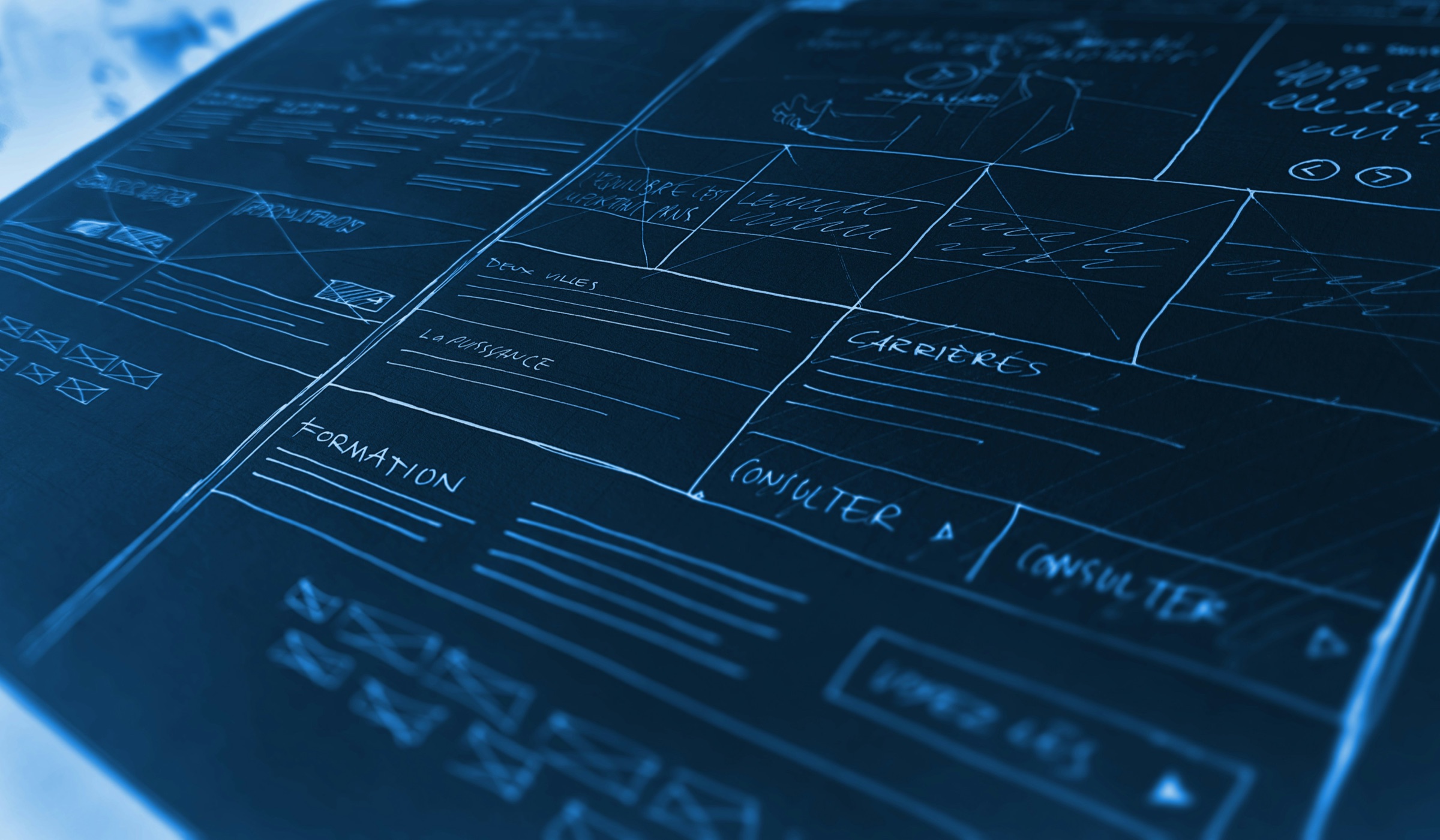 Blue-toned website wireframe sketch representing software and applications